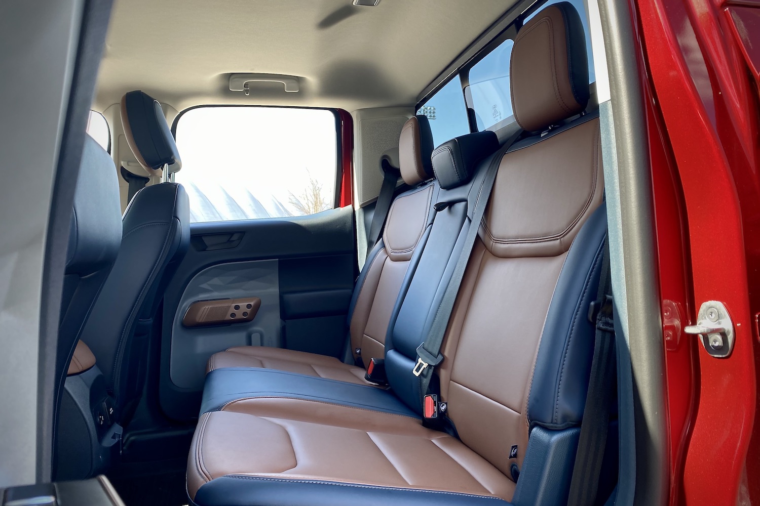 Rear seats in 2022 Ford Maverick from side profile outside of the truck.