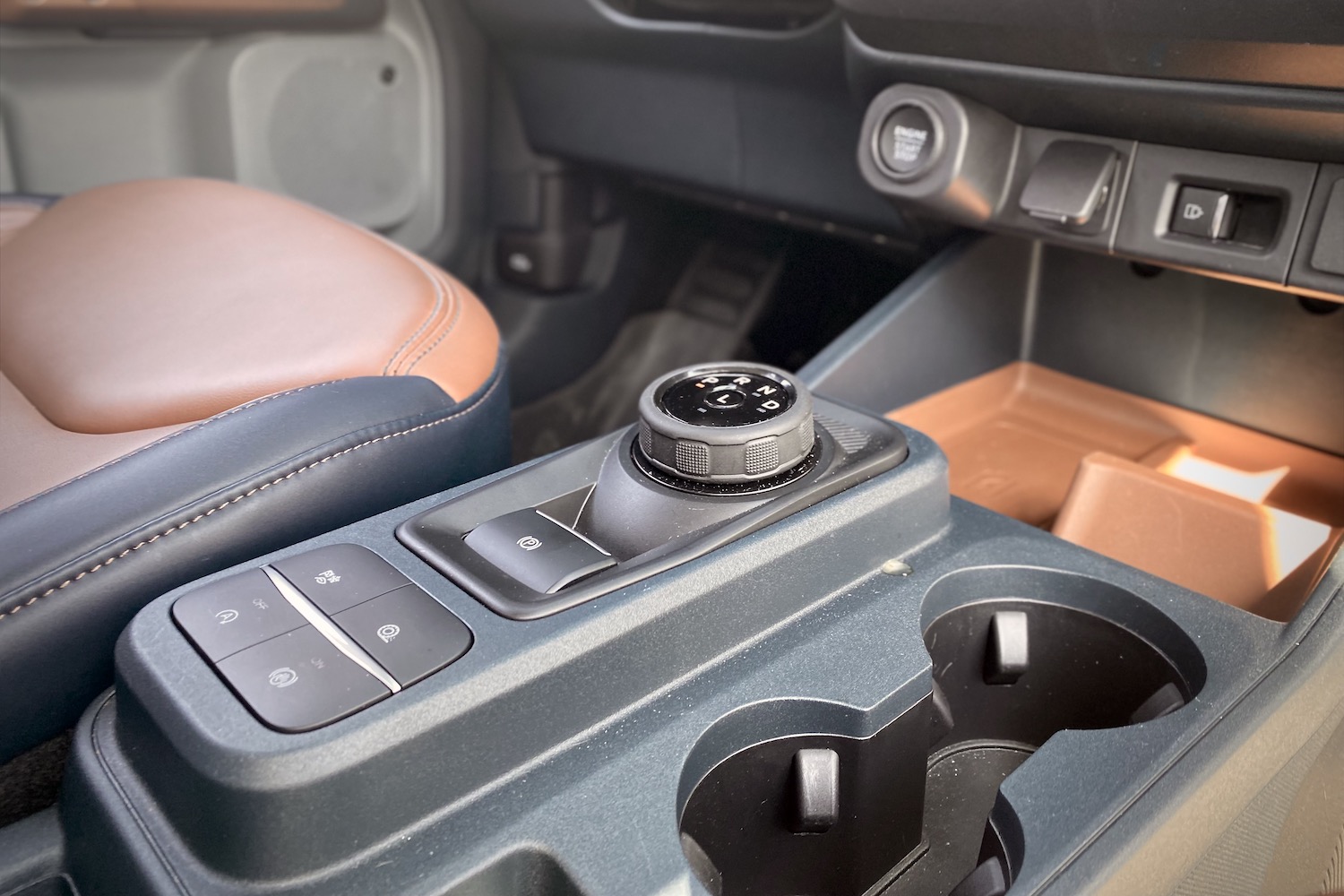Close up of 2022 Ford Maverick shifter and buttons in center console.