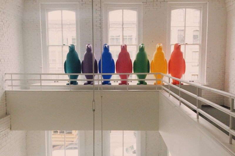 Colored penguins aligned on a balcony represent some the 21C Hotels' artworks.