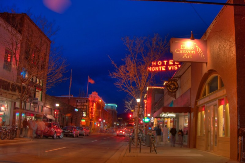 An image of some downtown Flagstaff buildings, including the Hotel Monte Vista, with artistic light