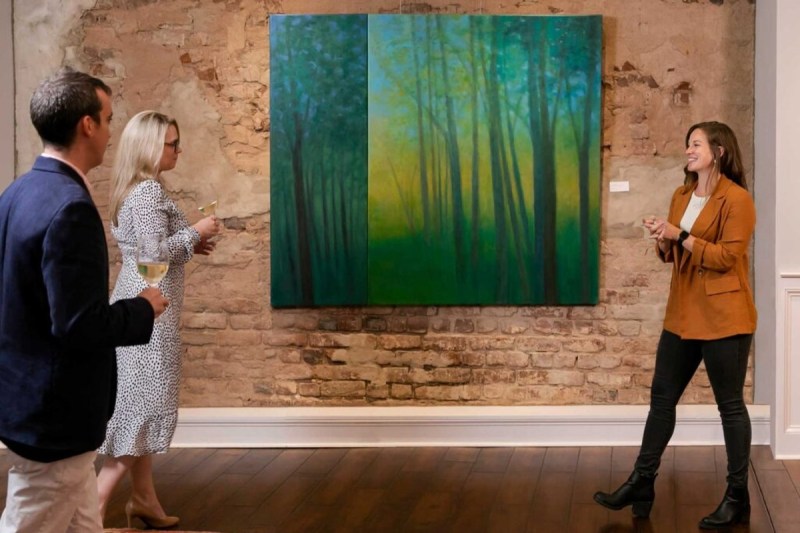 A tour guide speaks about a painting at The Vendue hotel in Charleston, South Carolina.