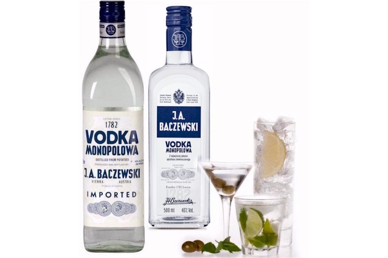 Vodka Monopolowa Bottles and a glass of vodka with lime.