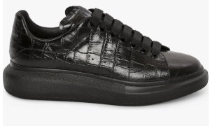 Black croc embossed oversize sneaker on a white background.