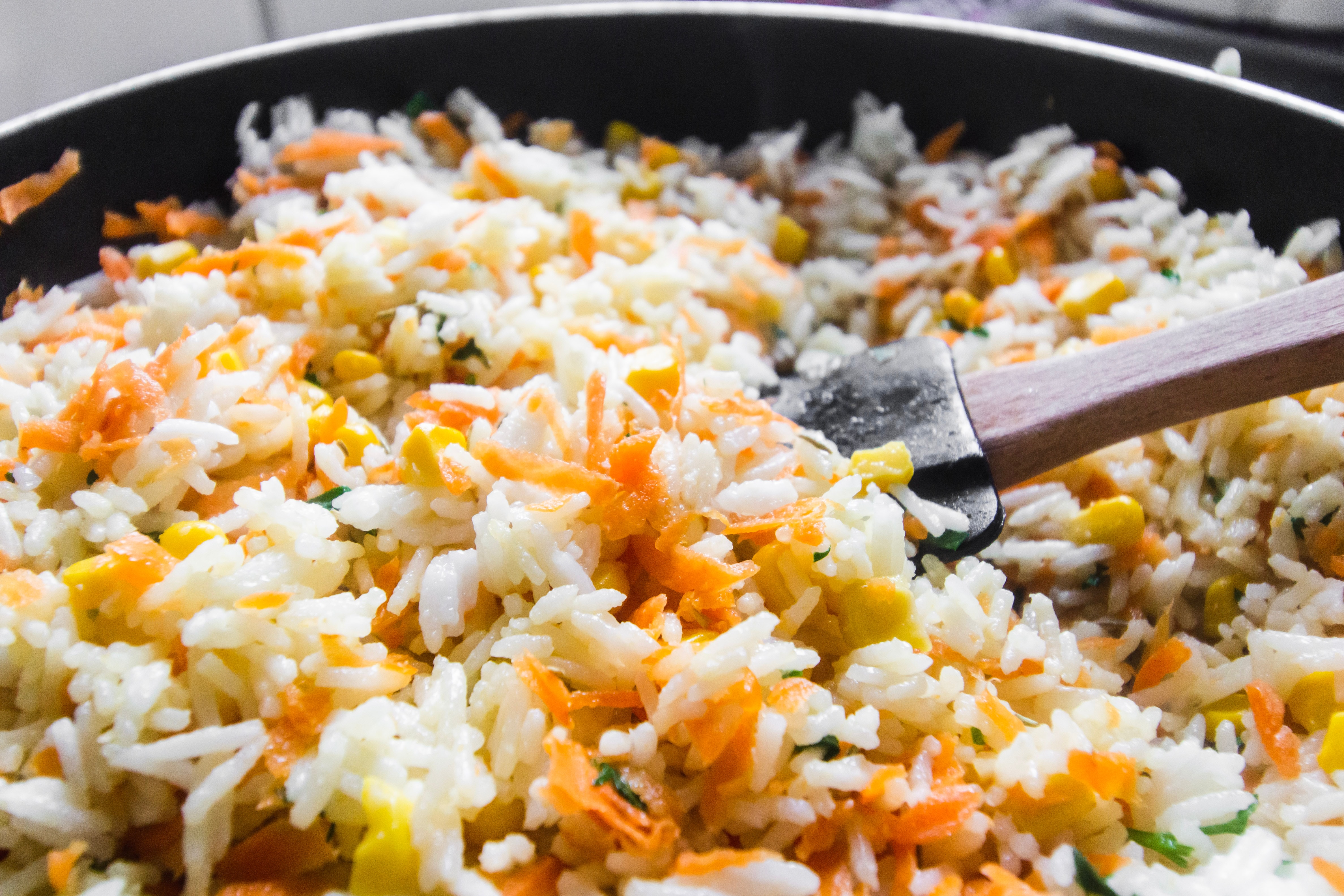 Frying rice in a skillet pan.