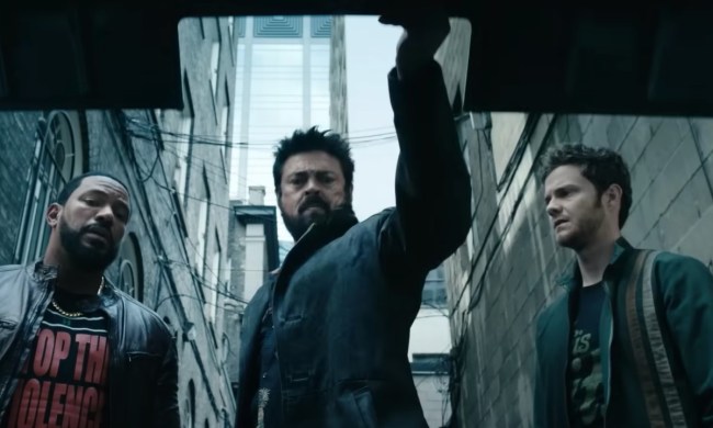 Hughie, Butcher, and Mother's Milk look down into a mysterious car trunk in "The Boys"