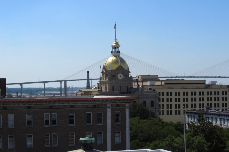 A view of Savannah City Hall with the Talmadge Bridge in the background.