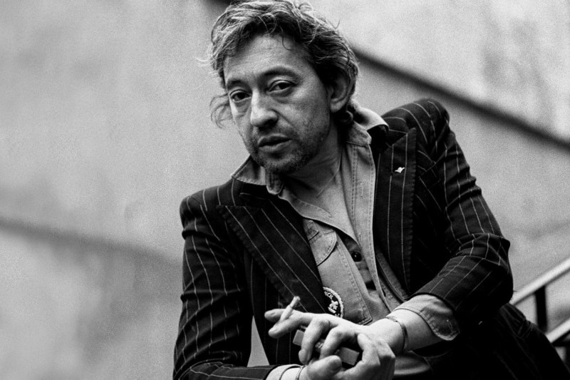Serge Gainsbourg in a military shirt and suit jacket in Paris in 1980