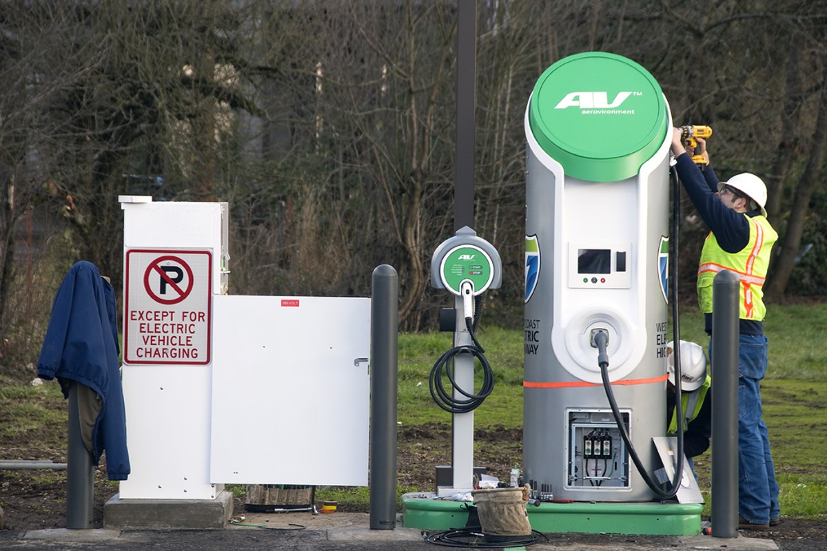 Workers assemble the charging station in Cottage Grove, Oregon.