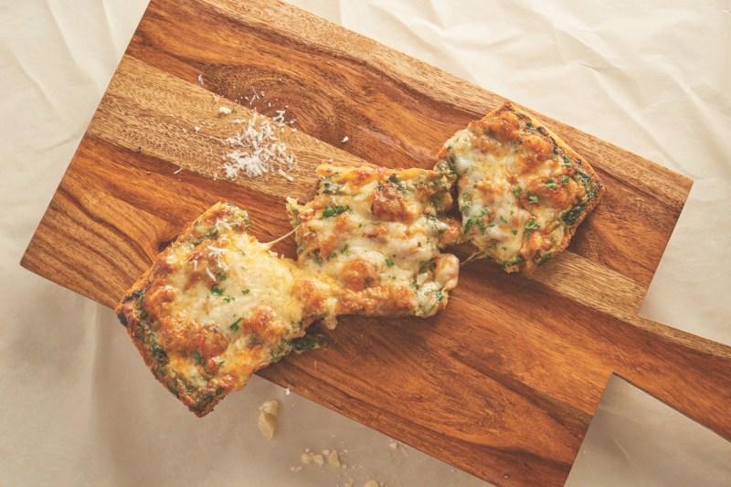Crawfish bread on a cutting board.