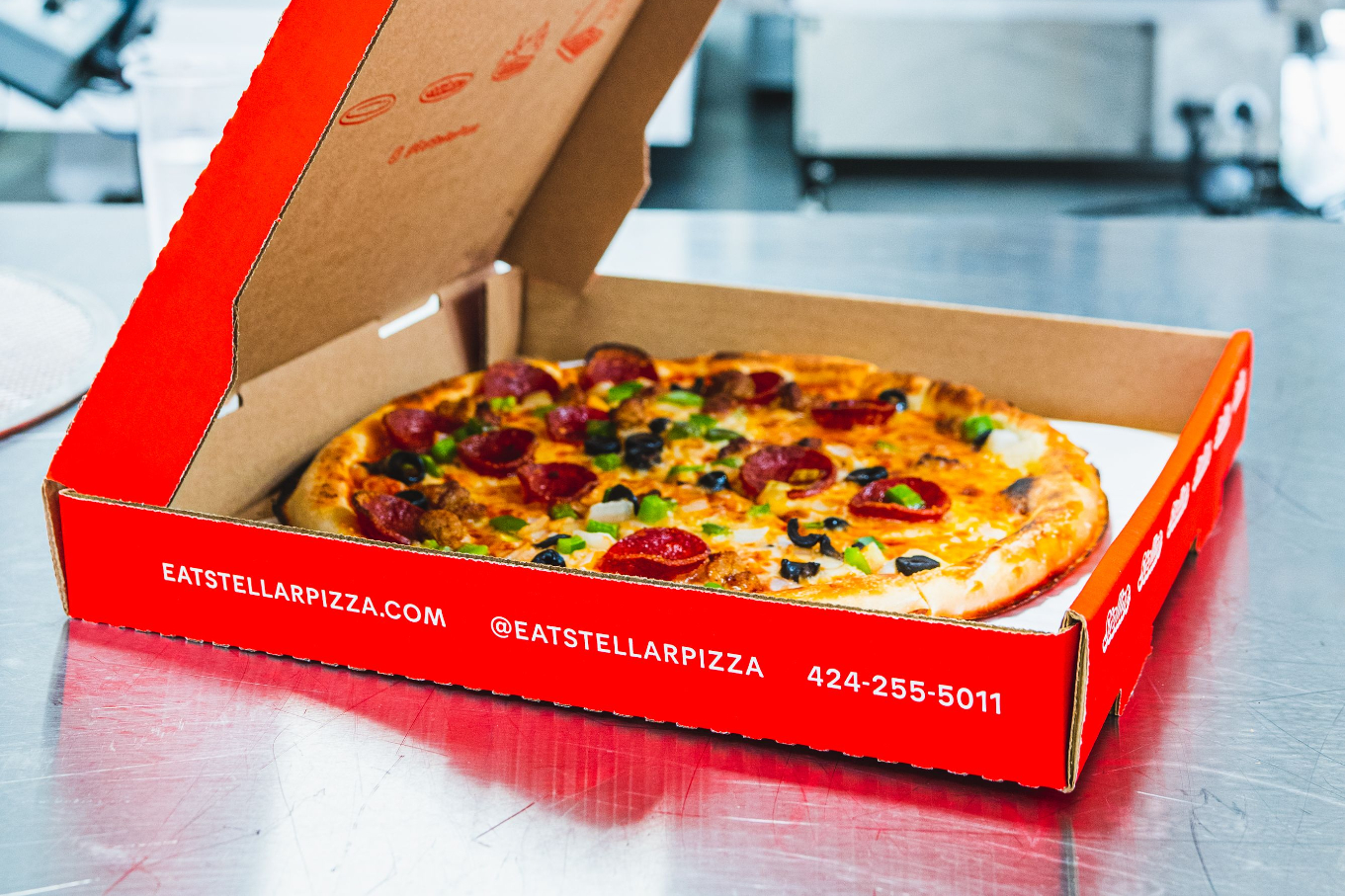 A Stellar Pizza pie in box.