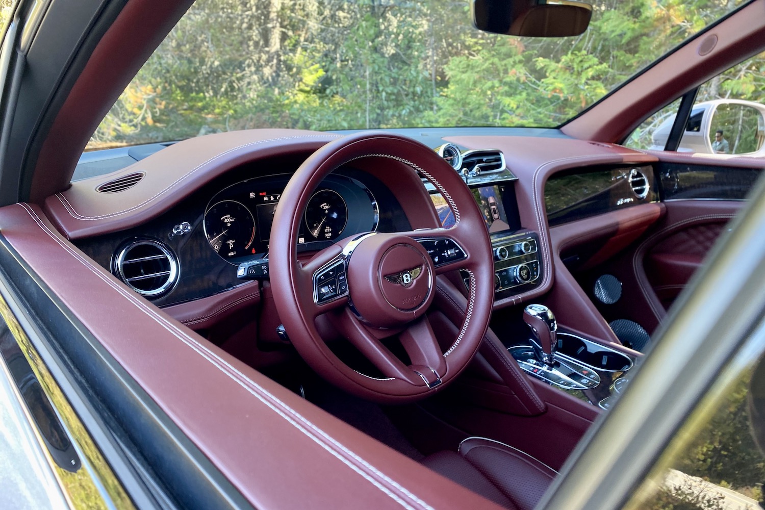 2023 Bentley Bentayga EWB steering wheel and dashboard in 2023 Bentley Bentayga EWB from outside the SUV.