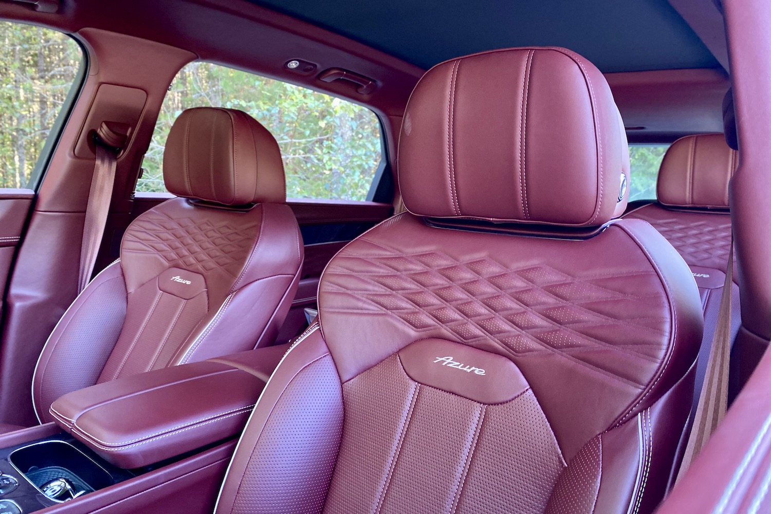 Close up of front seats in 2023 Bentley Bentayga EWB from outside the driver's side of the vehicle.