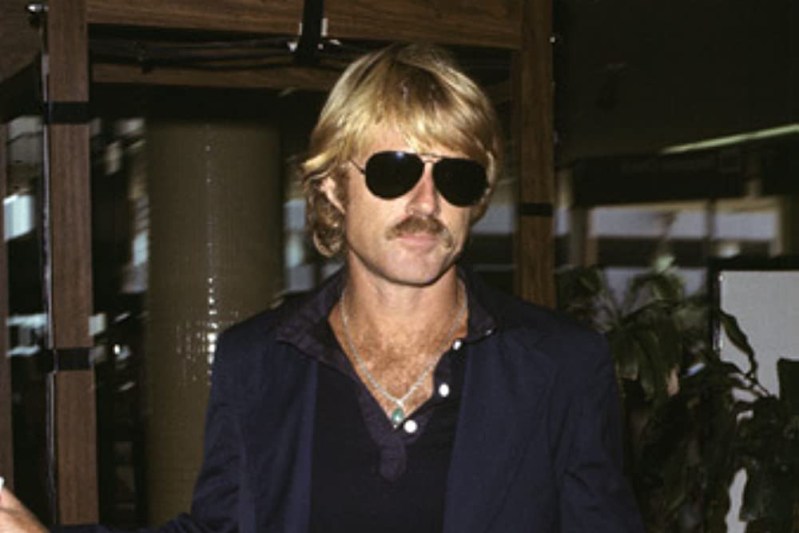 Robert Redford in aviator sunglasses.