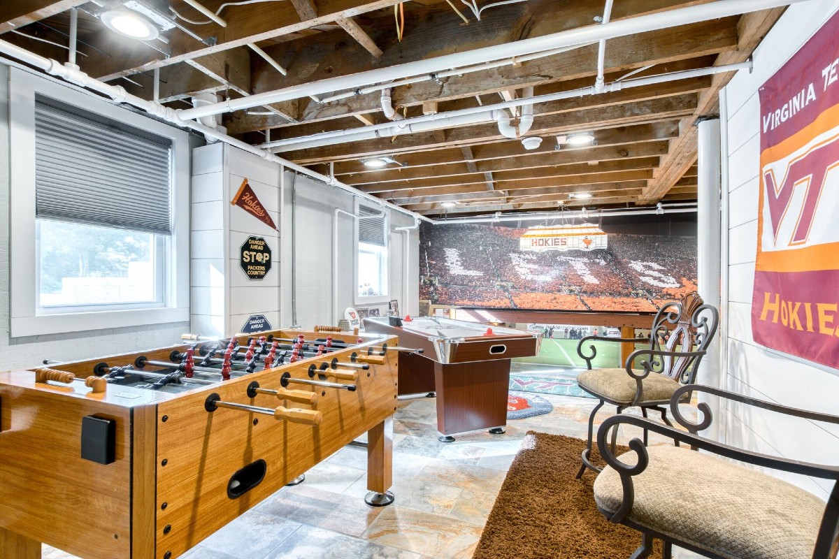 Virginia Tech vrbo game room with hokie gear.