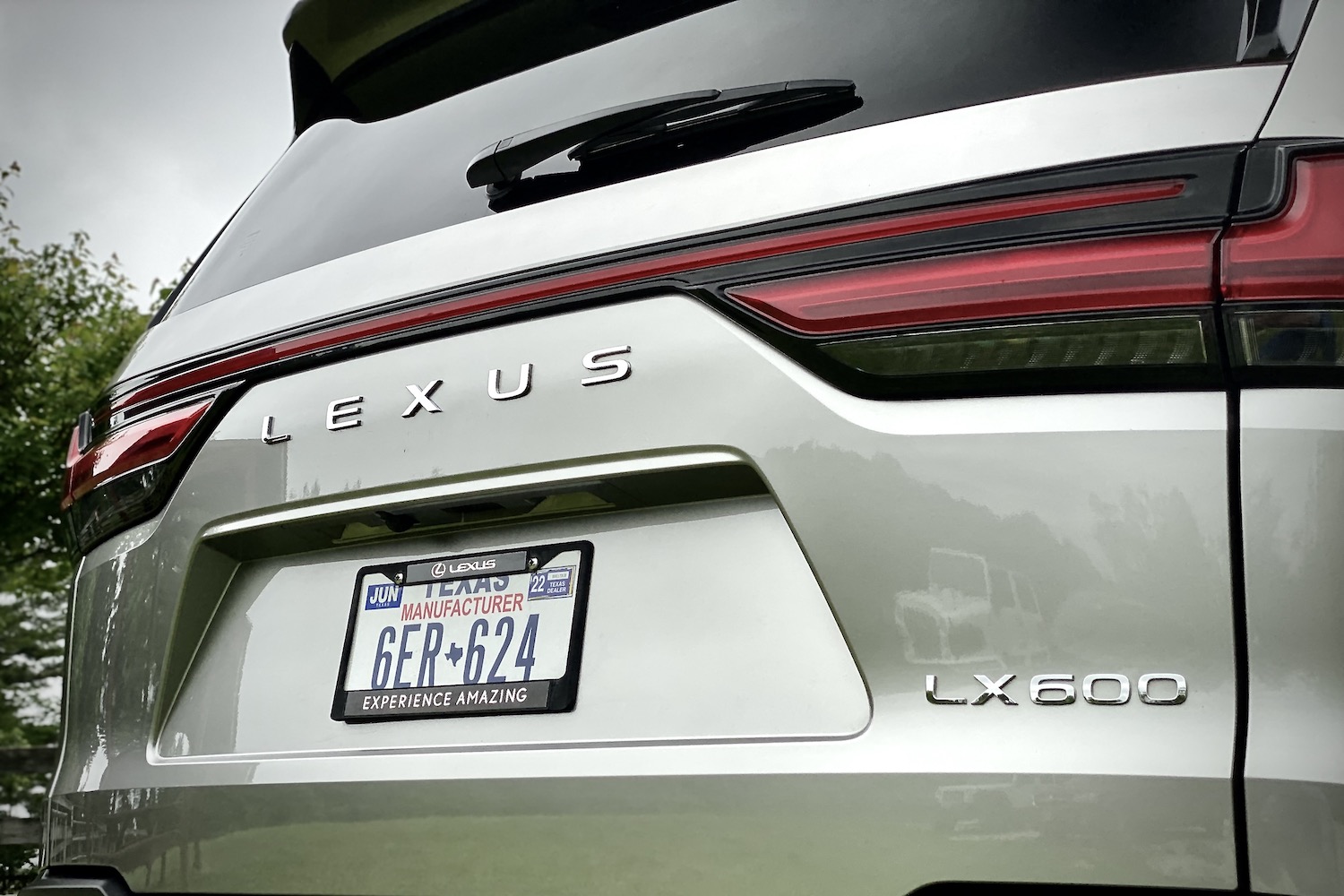 Close up of rear badge on the 2022 Lexus LX 600 liftgate and lighting.