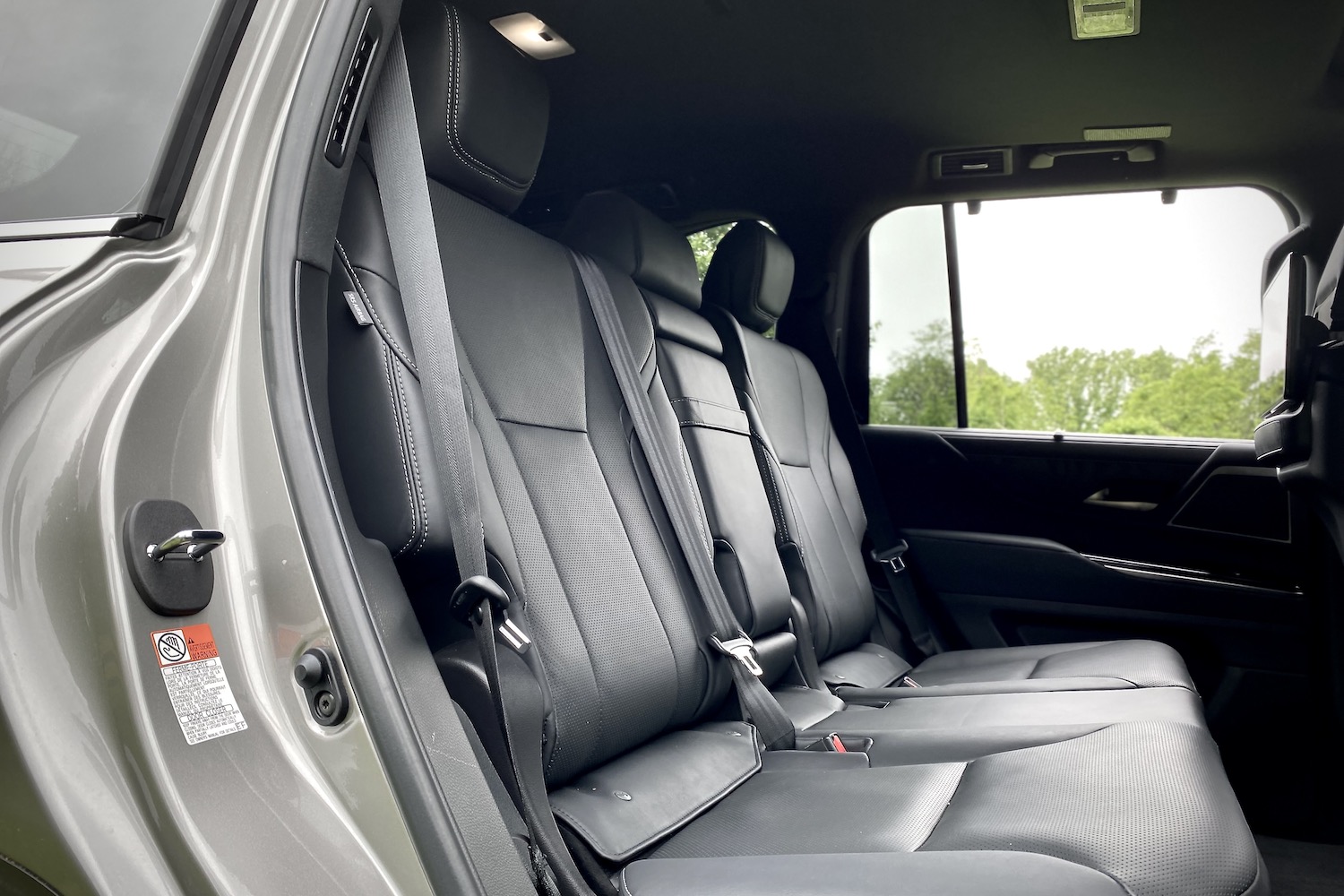Second-row seats in the 2022 Lexus LX 600 from the passenger's side outside the SUV.