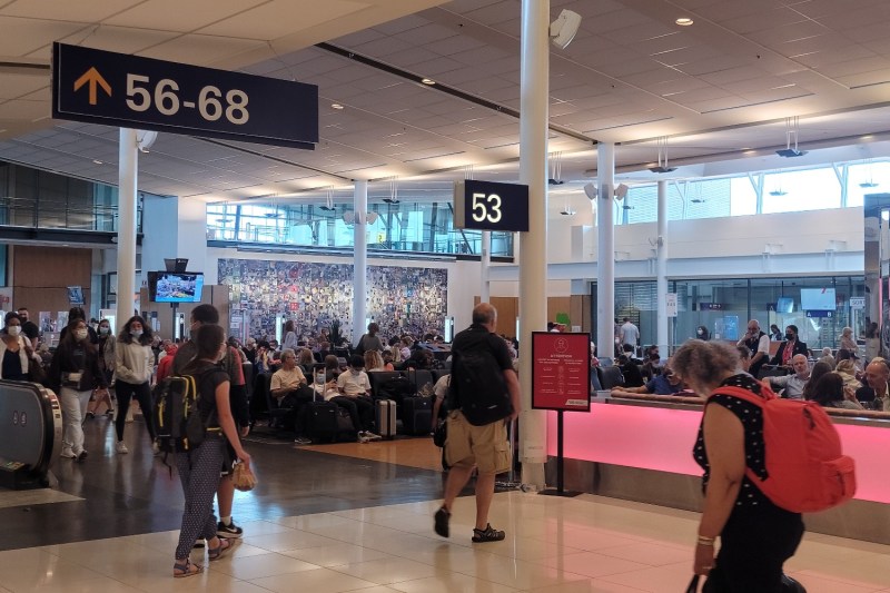 Travelers move through the terminal at Montréal-Pierre Elliott Trudeau International Airport near Montréal, Quebec, Canada.