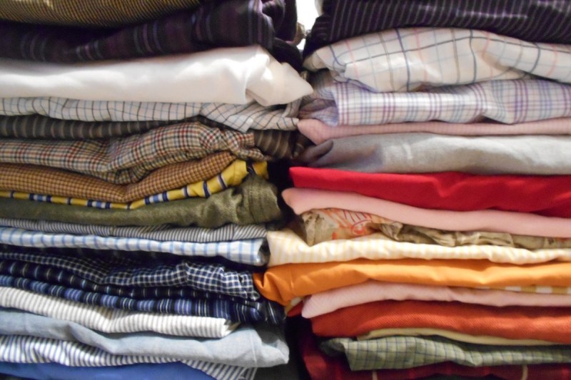 44 folded Goodwill shirts.