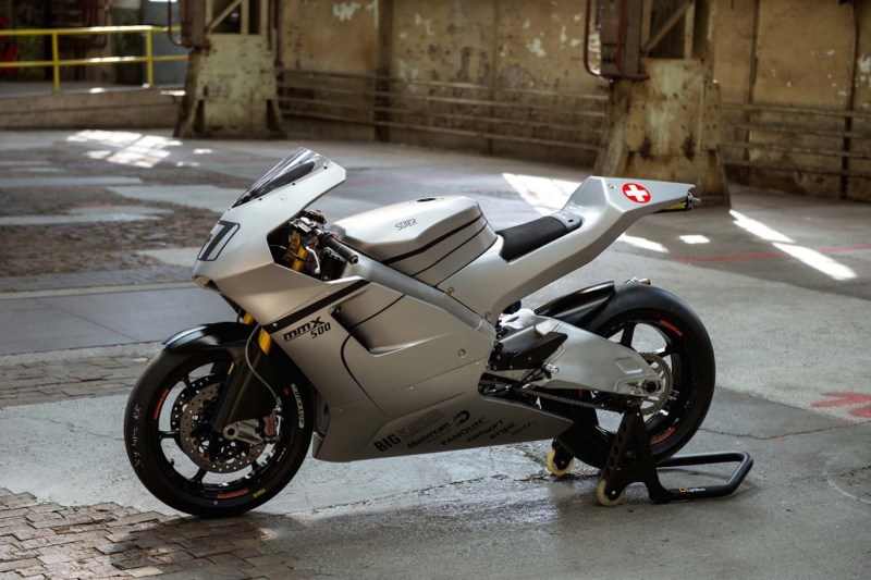 Suter Racing MMX 500 parked in a building on wet concrete.