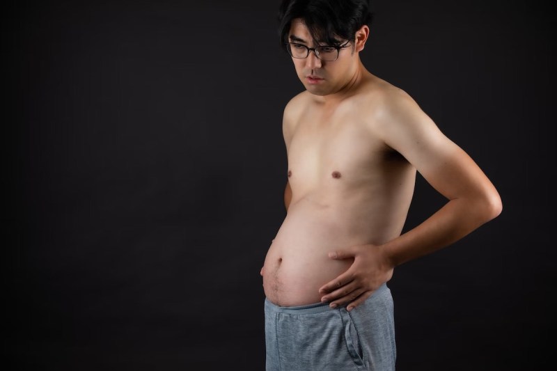 Man with bloated tummy.