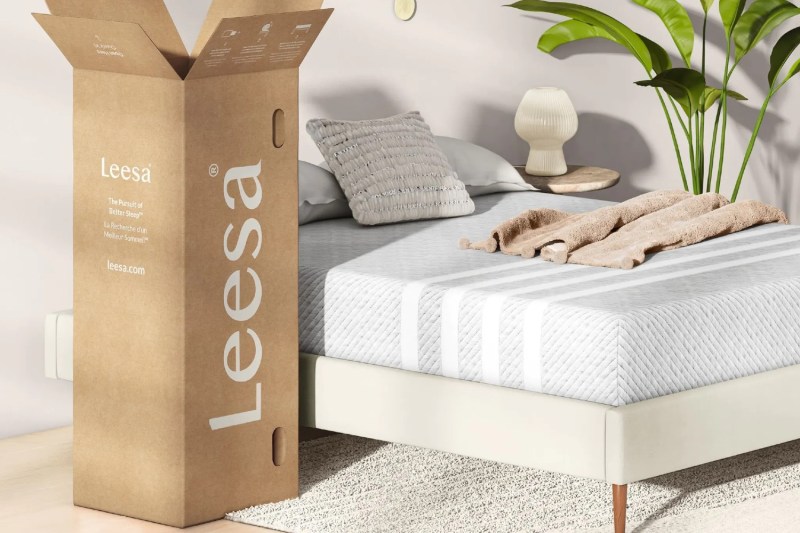 A Leesa mattress box and a Leesa mattress being used on a bed.