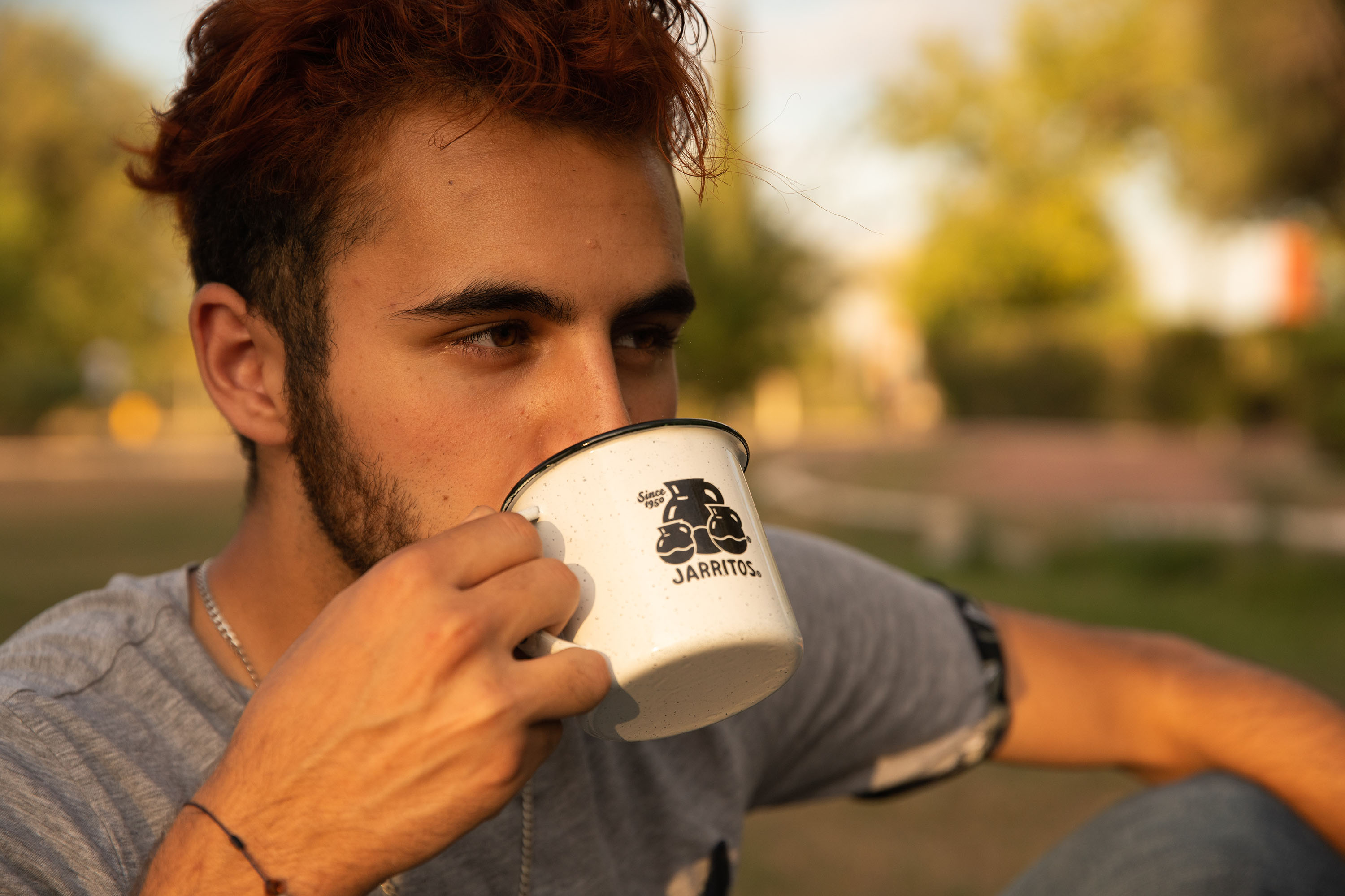 man drinking homemade coffee outside