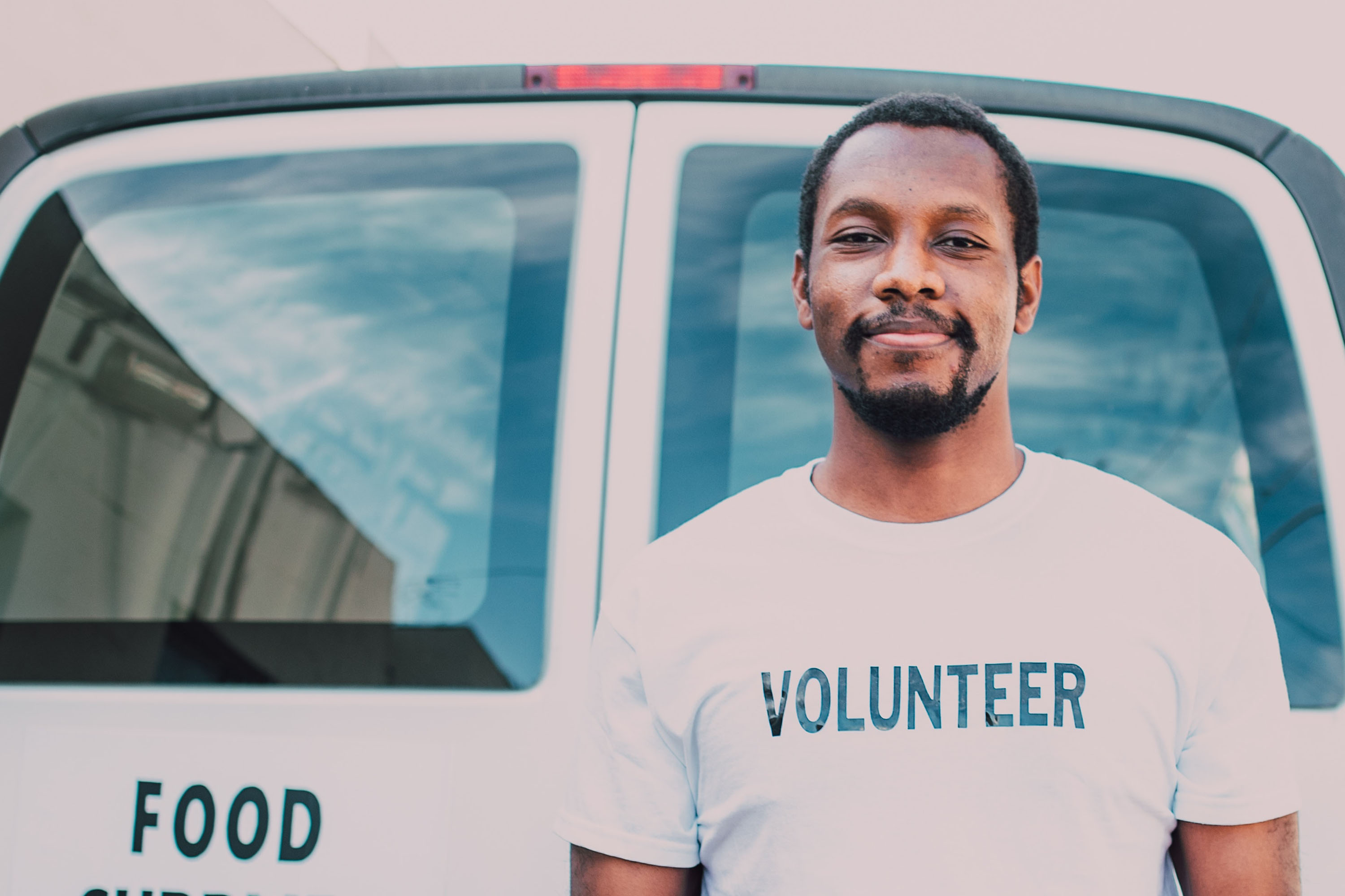 Man wearing a volunteer t-shirt