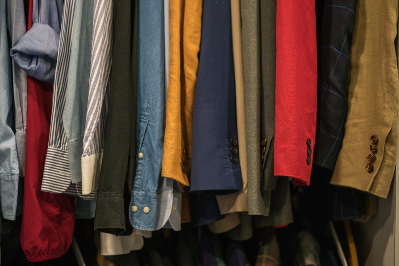 Men's shirts hanging in a closet