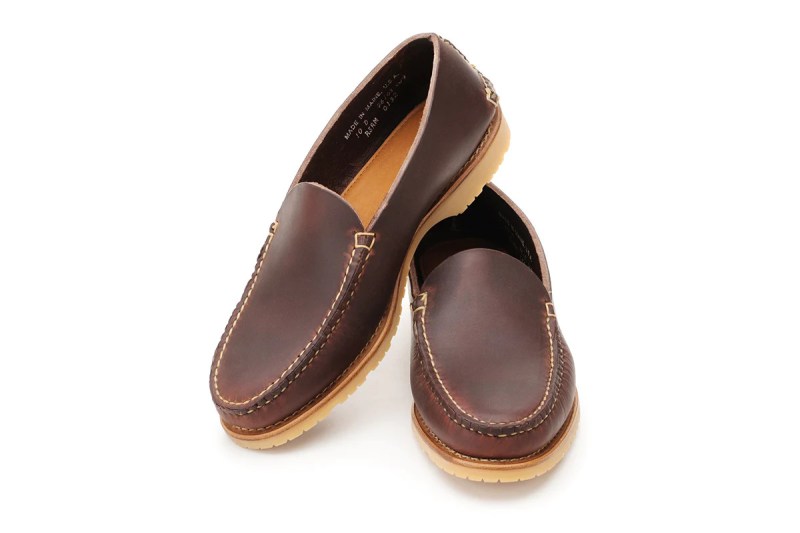 A pair of brown venetian slippers.