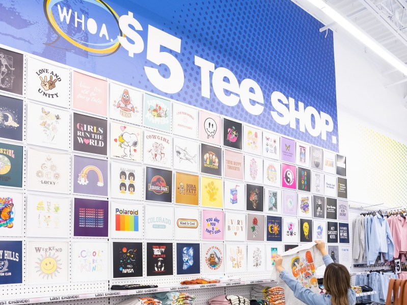 Five Below graphic tee selection wall in store.