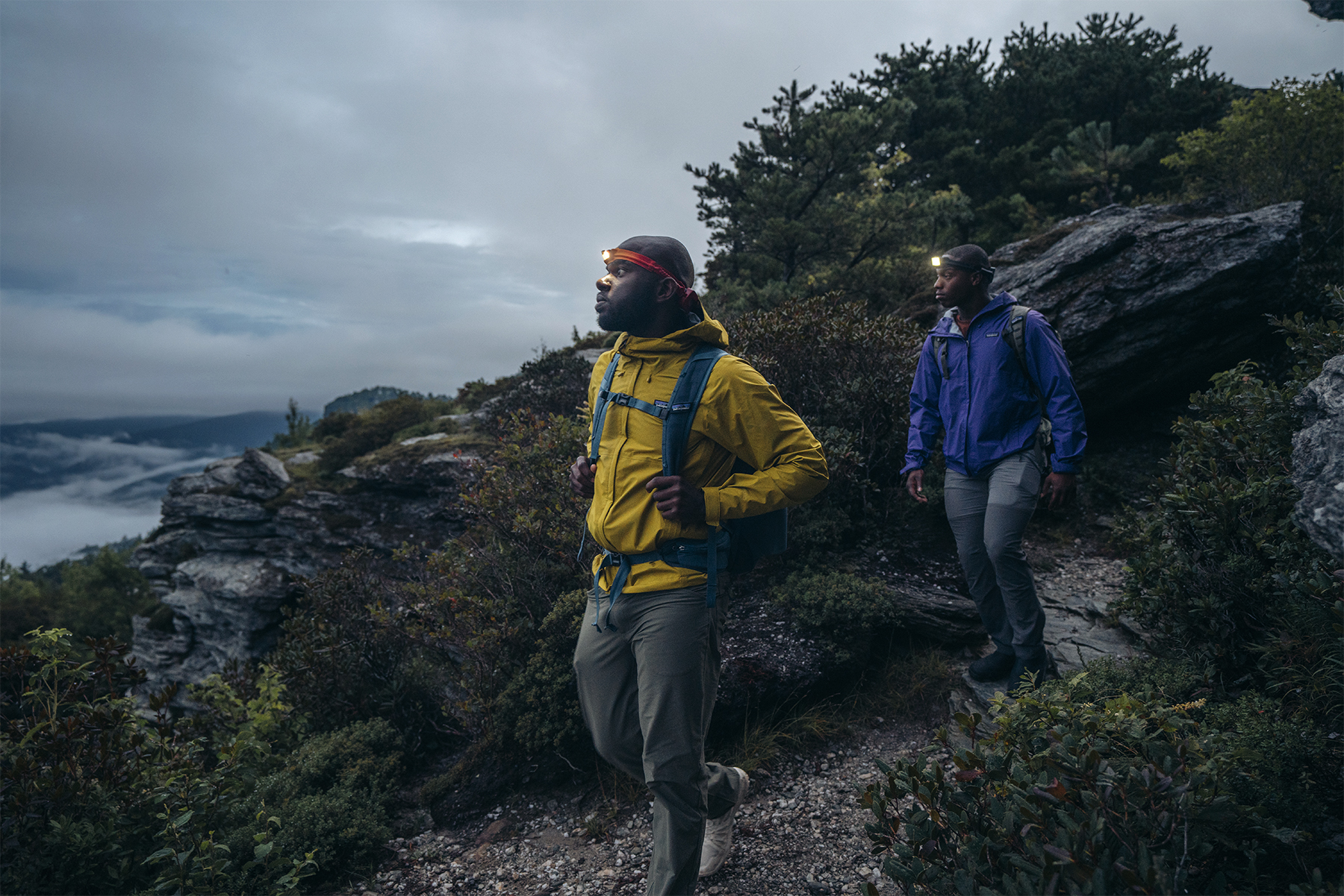 Two men walk a trail using the BioLite HeadLamp 425.