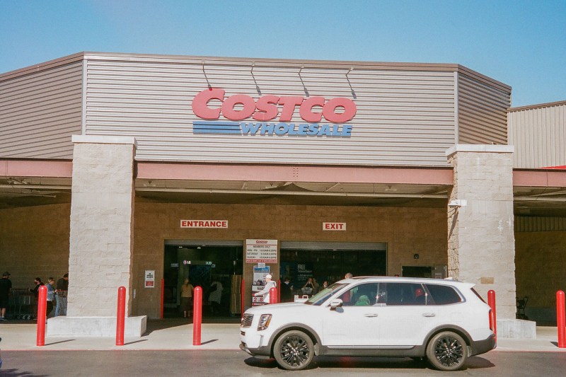 Costco storefront with car parked in front
