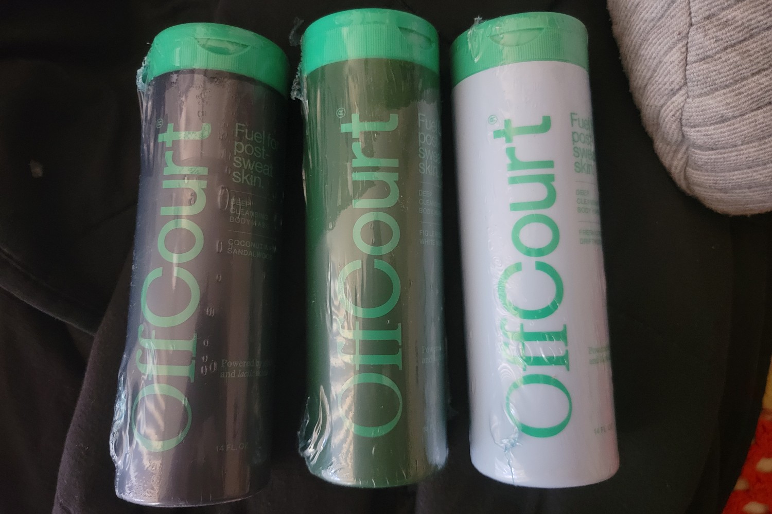 A group of bottles of OffCourt Deep Cleansing Body Wash.