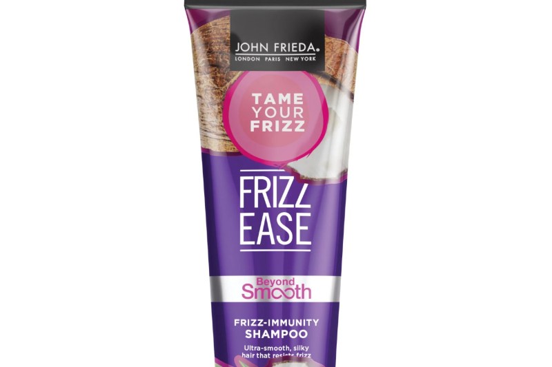 A close-up of a bottle of John Frieda Frizz Ease Beyond Smooth Shampoo.
