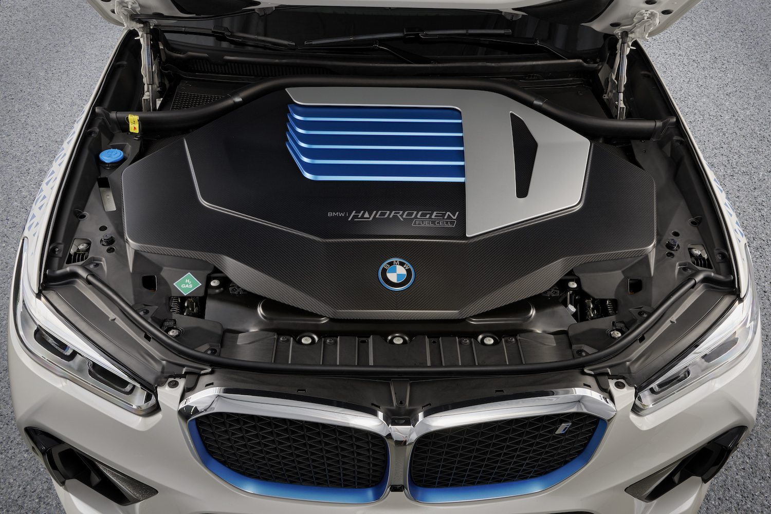Close up photo of BMW iX5 Hydrogen fuel cell engine underneath the hood.