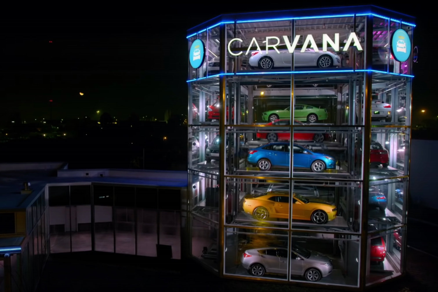 Close up of Carvana Vending Machine with cars inside at night.