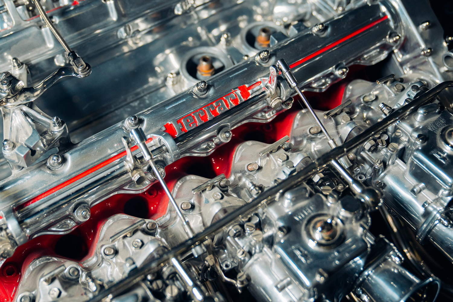 Close up of Ferrari V12 engine valve cover on Ferrari V12 Table.