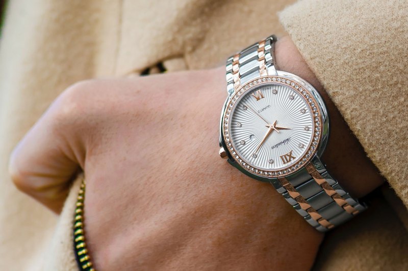 Luxury metal wristwatch in a man's pocket.