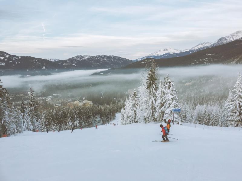 Two skiers at Whistler Blackcomb ski resort.
