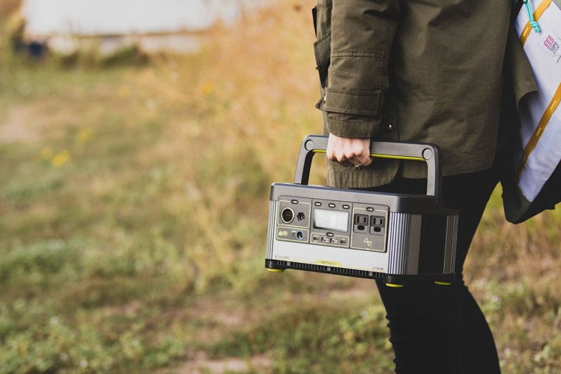 Man carrying Goal Zero Yeti 500X Portable Power Station.