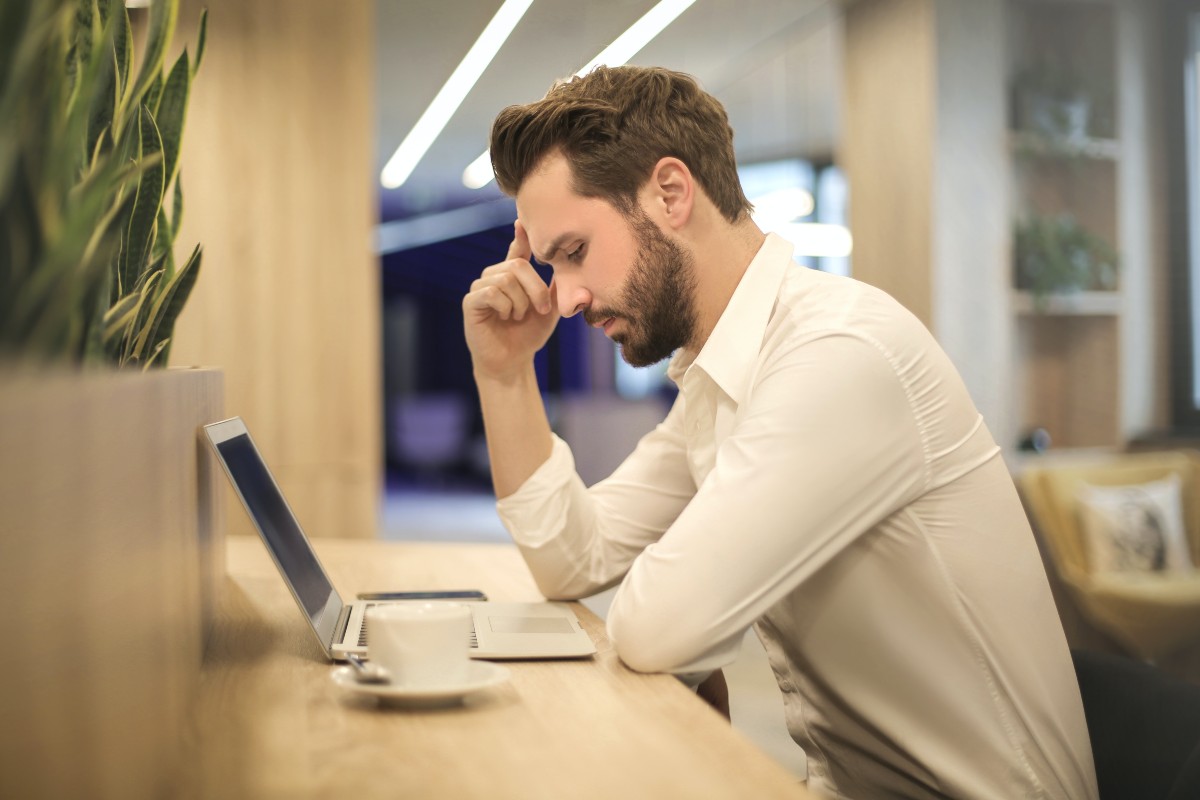 a tired man at his desk