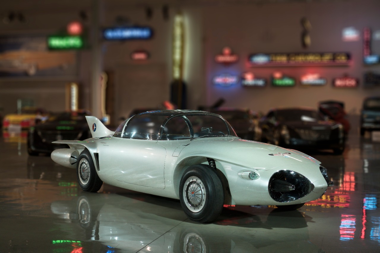 1956 General Motors Firebird II front end angle from passenger's side in a warehouse of cars.