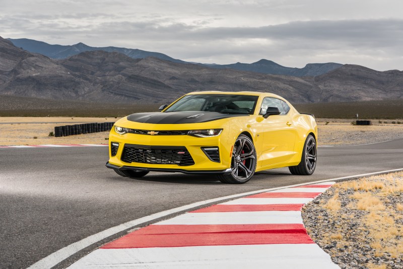 2017 Chevrolet Camaro SS 1LE front end angle from driver's side parked on a race track with mountains in the back.