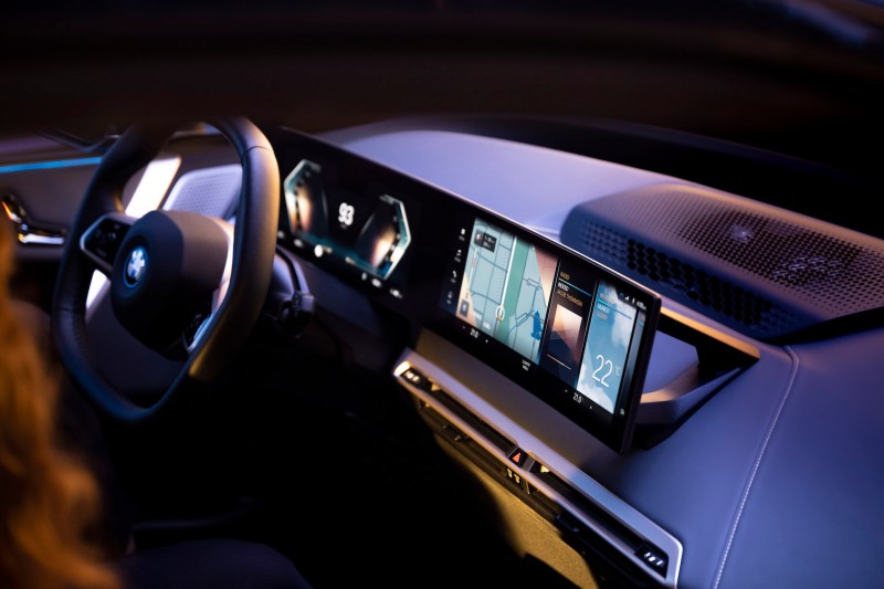 2022 BMW iX xDrive50 iDrive 8 Infotainment from outside the car with a focus on the dashboard.