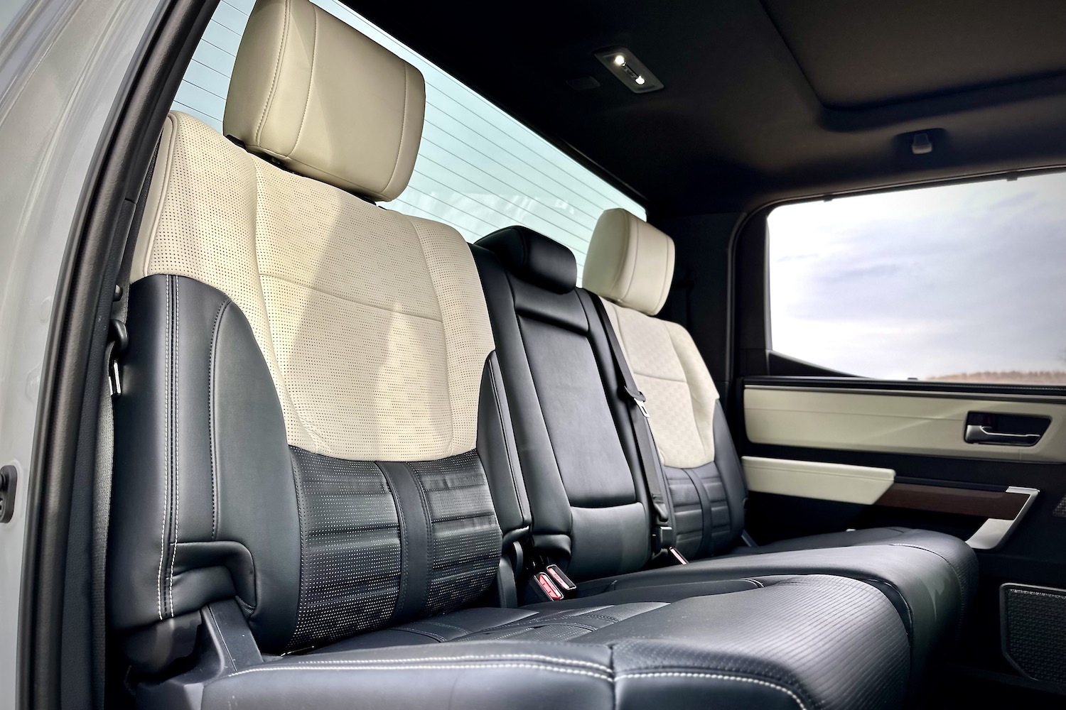 Close up of rear seats from outside passenger's side in the 2022 Toyota Tundra Hybrid Capstone.