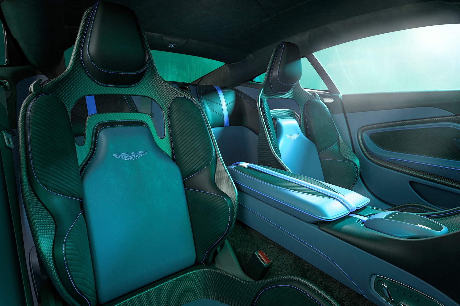 Close up of front seats in the 2023 Aston Martin DBS 770 Ultimate in a green studio with dramatic lighting.