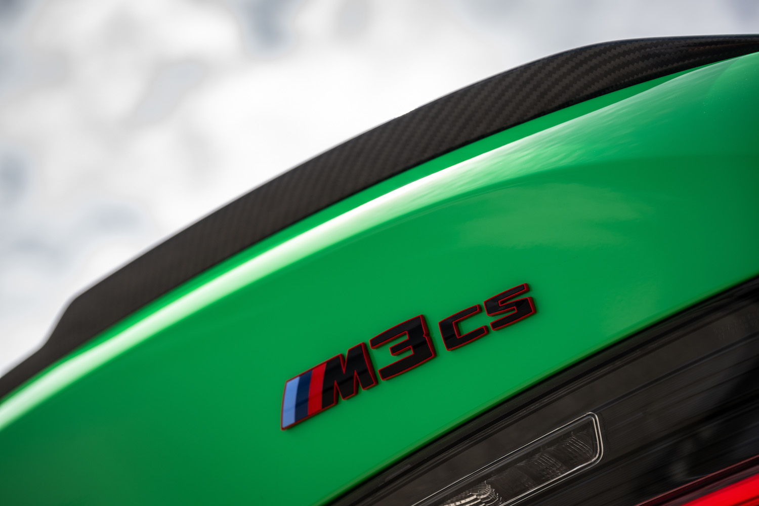 Close up of 2024 BMW M3 CS rear badge on the trunk lid.