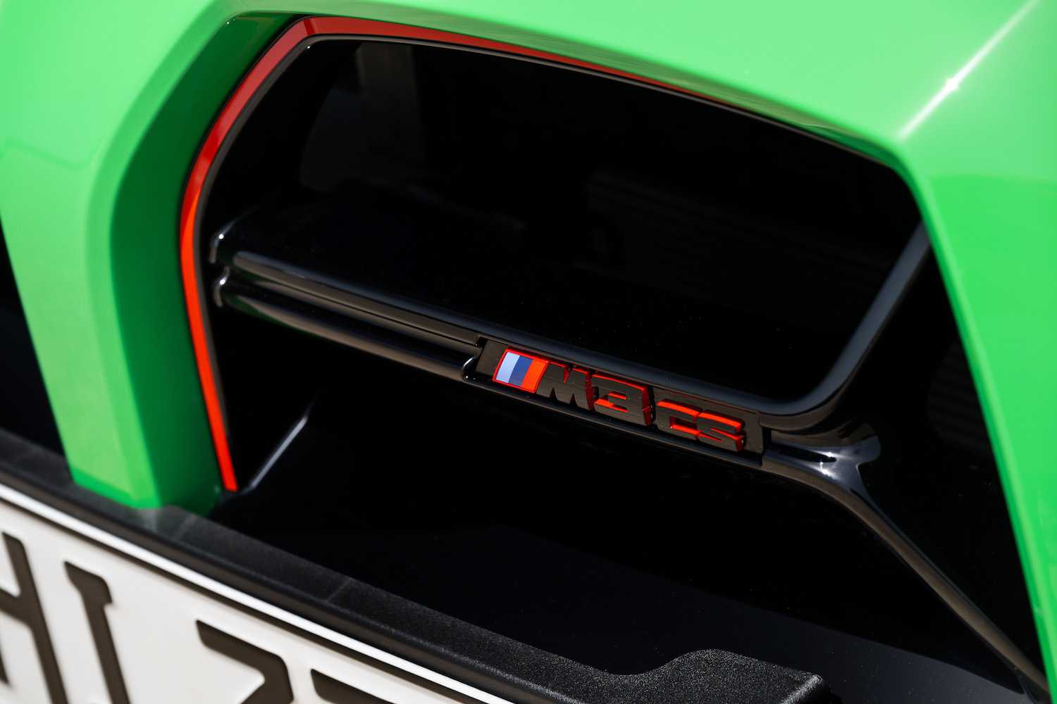 Close up of 2024 BMW M3 CS front badge on the grille.