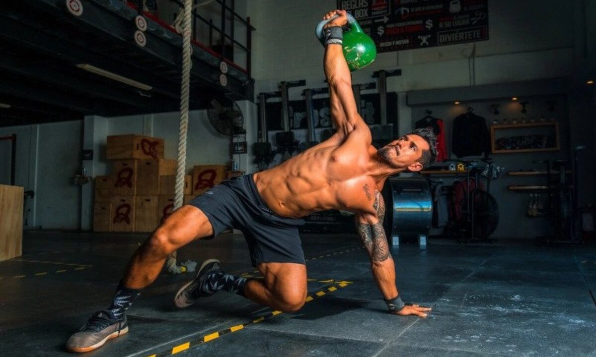 Man doing ab exercise with kettlebell
