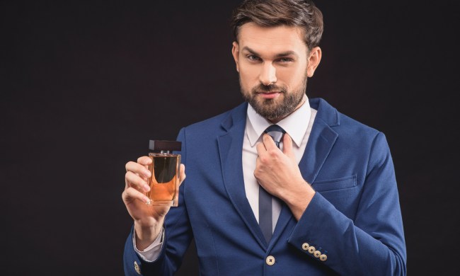 where to apply winter fragrances man holding cologne